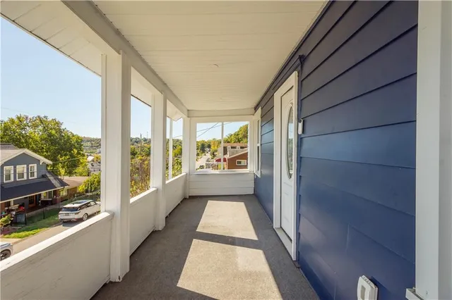 a view of a glass door with a balcony