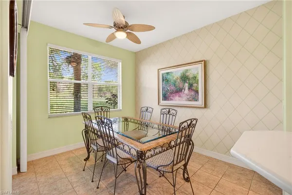 a kitchen with stainless steel appliances a sink a stove a microwave a refrigerator a sink and cabinets