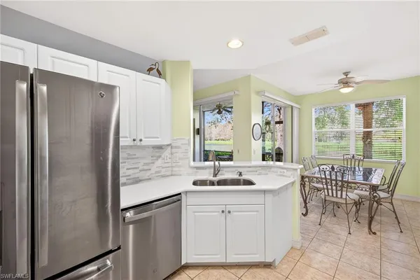 a kitchen with a sink stove and microwave