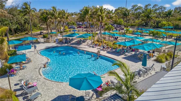 a view of a swimming pool with sitting area
