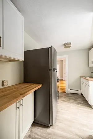 a kitchen with stainless steel appliances a refrigerator and a stove