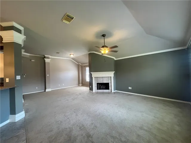 a view of an empty room with a fireplace
