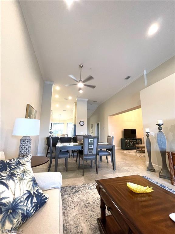 9426 Benvenuto Court, Unit 203 Naples, FL 34119 - Photo 13 of 42 a living room with furniture and a flat screen tv