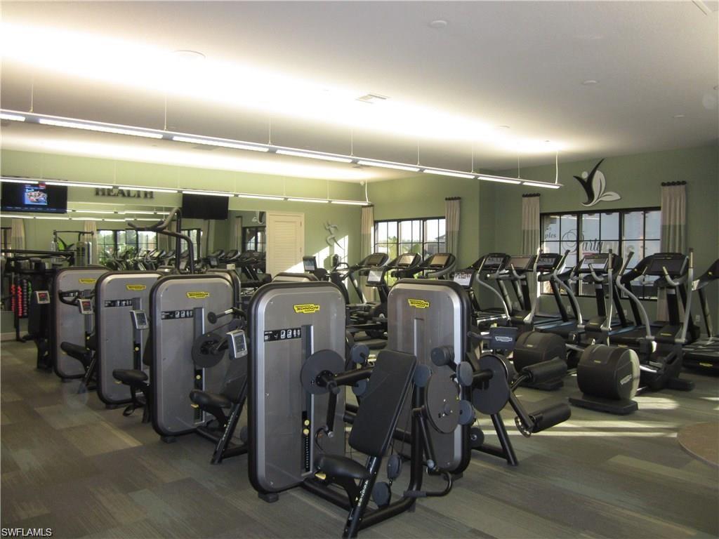 9426 Benvenuto Court, Unit 203 Naples, FL 34119 - Photo 32 of 42 a view of a room with gym equipment
