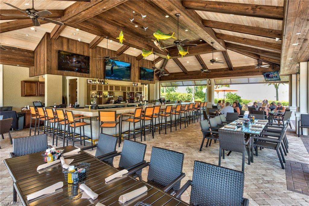 9426 Benvenuto Court, Unit 203 Naples, FL 34119 - Photo 35 of 42 a outdoor space with patio lots of furniture