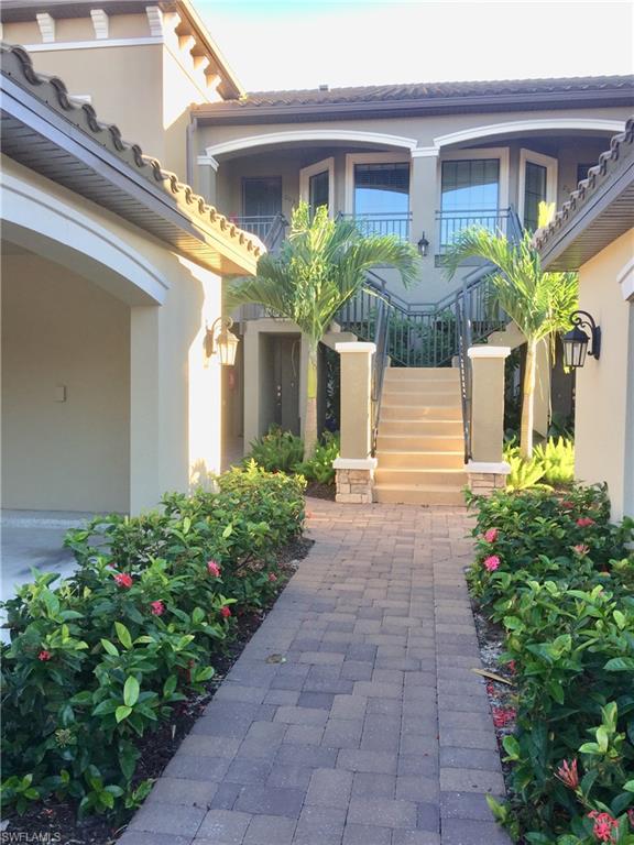 9426 Benvenuto Court, Unit 203 Naples, FL 34119 - Photo 4 of 42 a front view of a house with plants