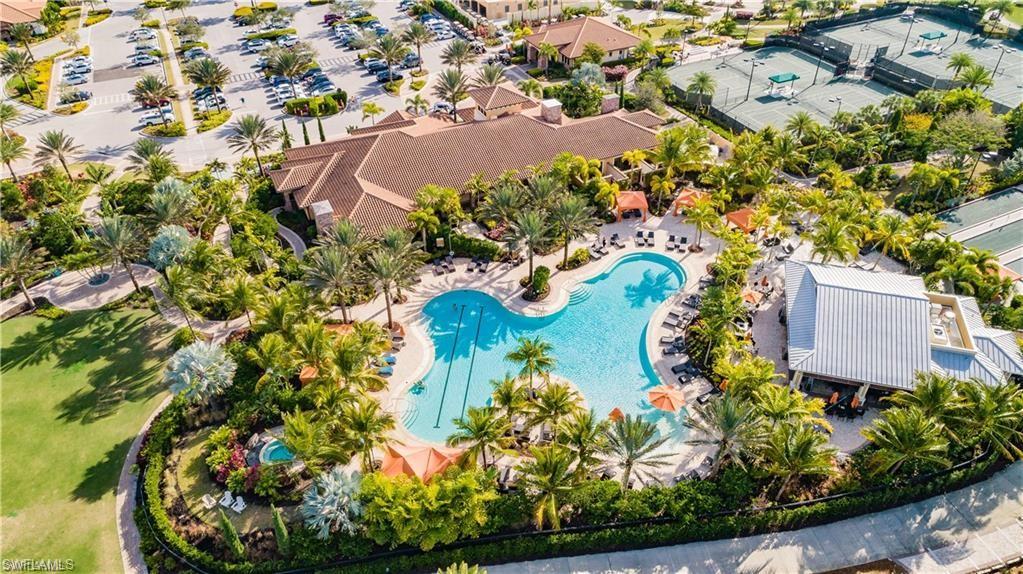 9426 Benvenuto Court, Unit 203 Naples, FL 34119 - Photo 40 of 42 an aerial view of residential house with outdoor space and swimming pool