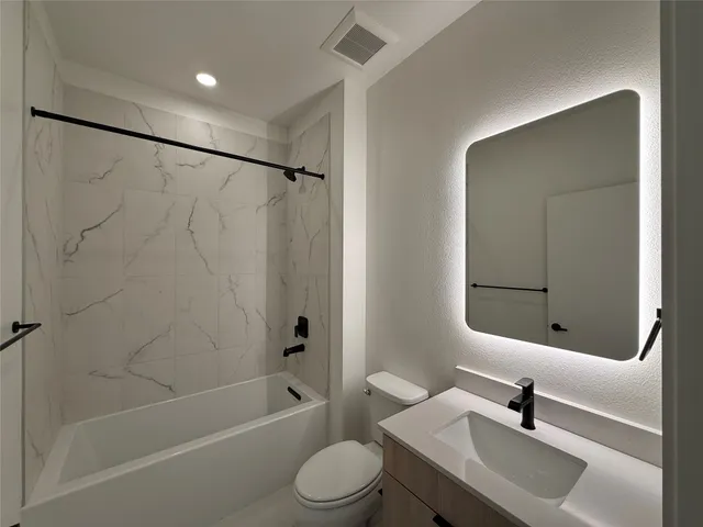 a view of a swimming pool with a chair and palm trees