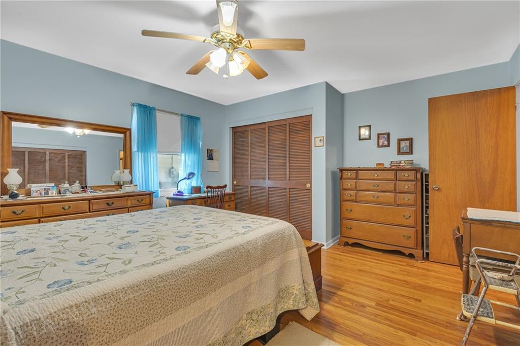 111 Truman Street Monaca, PA 15061 - Photo 11 of 23 a spacious bedroom with a bed and a view of living room