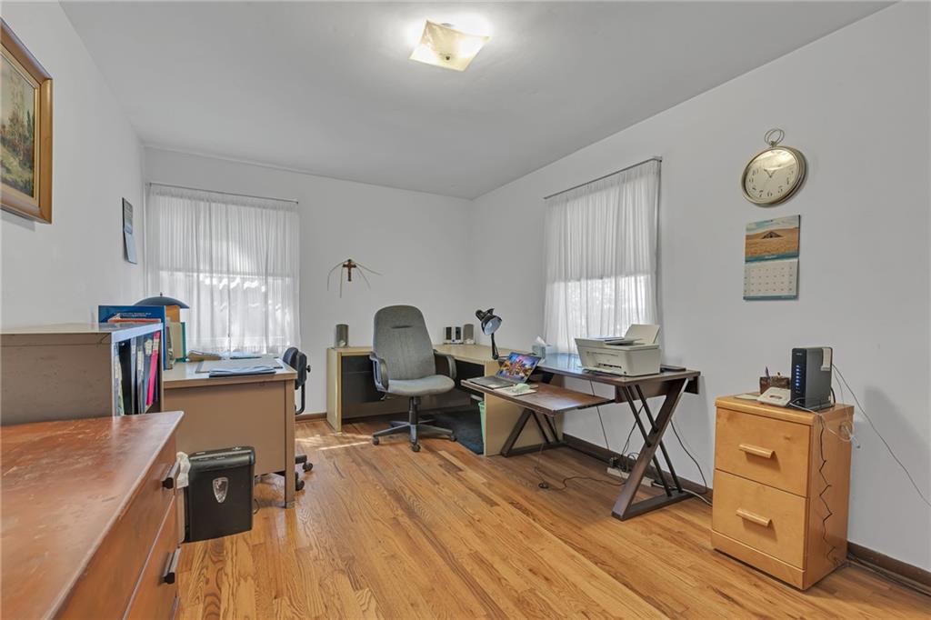 111 Truman Street Monaca, PA 15061 - Photo 12 of 23 a work room with furniture a window and wooden floor