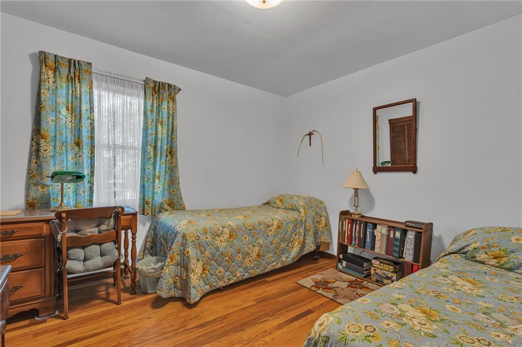 111 Truman Street Monaca, PA 15061 - Photo 15 of 23 a bedroom with two beds and a large window