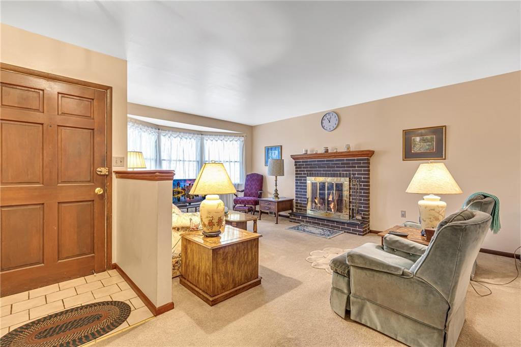 111 Truman Street Monaca, PA 15061 - Photo 16 of 23 a living room with furniture and a fireplace