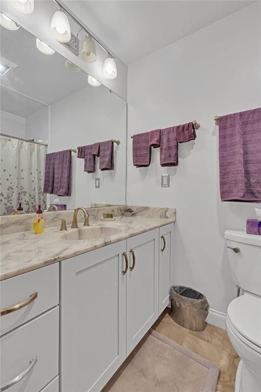 111 Truman Street Monaca, PA 15061 - Photo 19 of 23 a bathroom with a granite countertop sink a toilet and a mirror