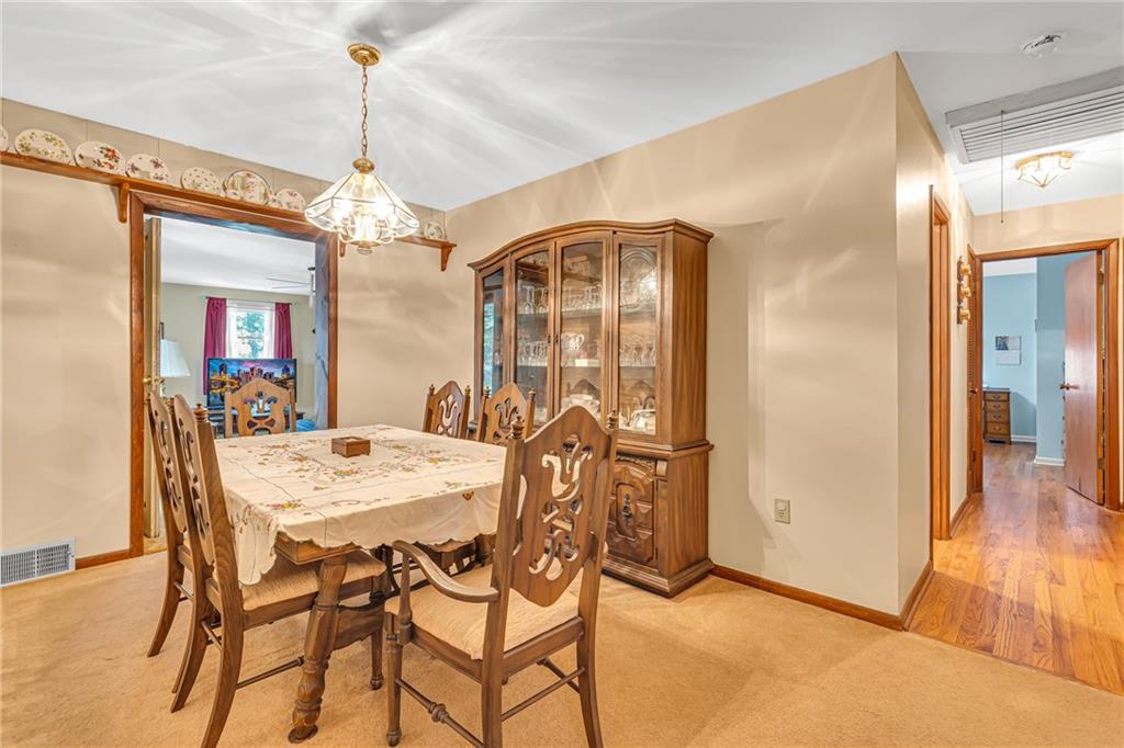 111 Truman Street Monaca, PA 15061 - Photo 5 of 23 a view of a dining room with furniture and wooden floor