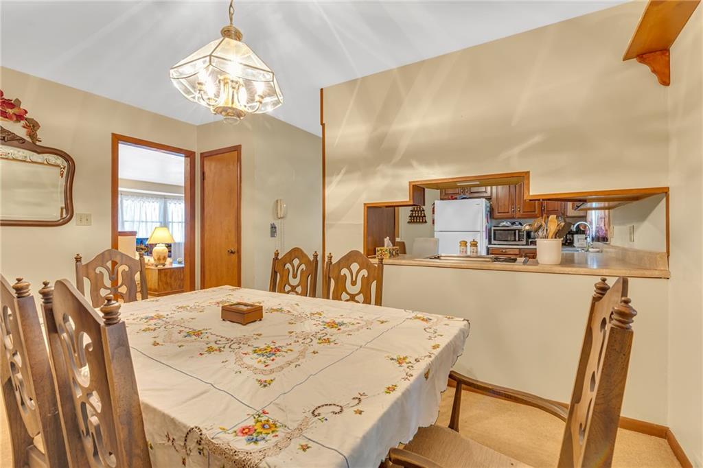 111 Truman Street Monaca, PA 15061 - Photo 6 of 23 a view of a dining room with furniture and a chandelier