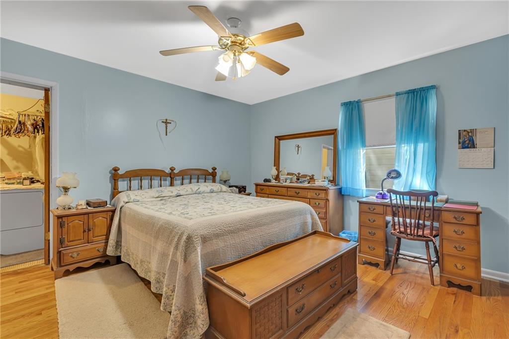 111 Truman Street Monaca, PA 15061 - Photo 10 of 23 a bedroom with a bed and wooden furniture