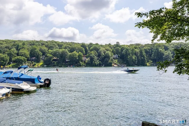 a view of a street with parked cars