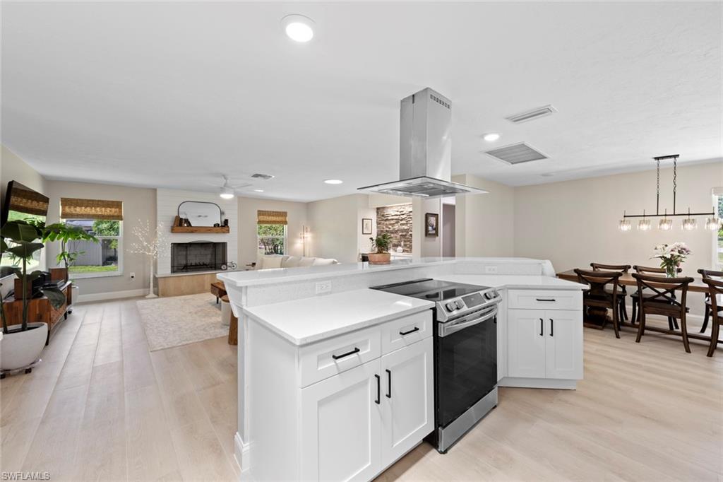 3795 Liberty Square Fort Myers, FL 33908 - Photo 17 of 43 a kitchen with a stove and a refrigerator