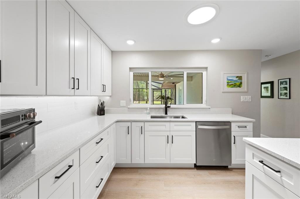 3795 Liberty Square Fort Myers, FL 33908 - Photo 18 of 43 a kitchen with sink cabinets and window