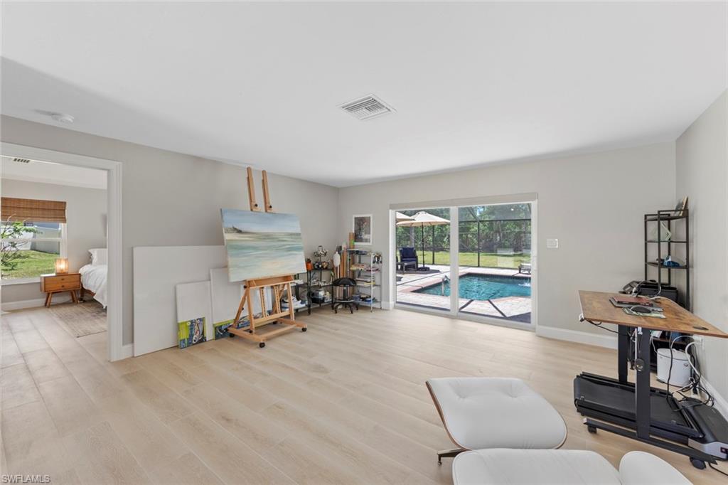 3795 Liberty Square Fort Myers, FL 33908 - Photo 22 of 43 a living room with furniture and a flat screen tv