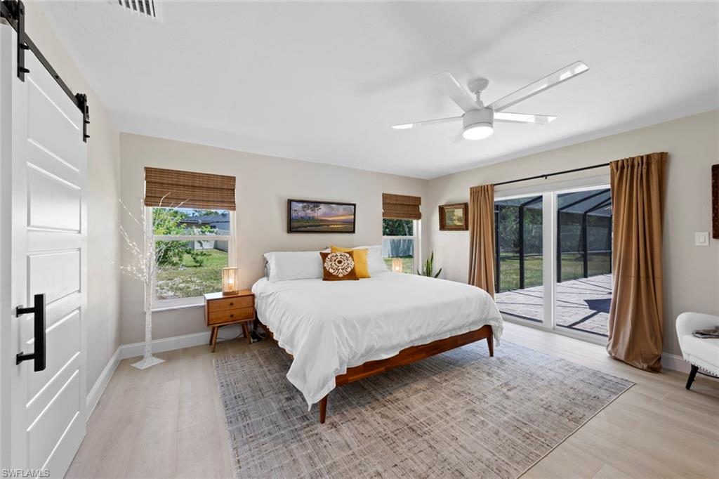 3795 Liberty Square Fort Myers, FL 33908 - Photo 24 of 43 a bedroom with a large bed and a window