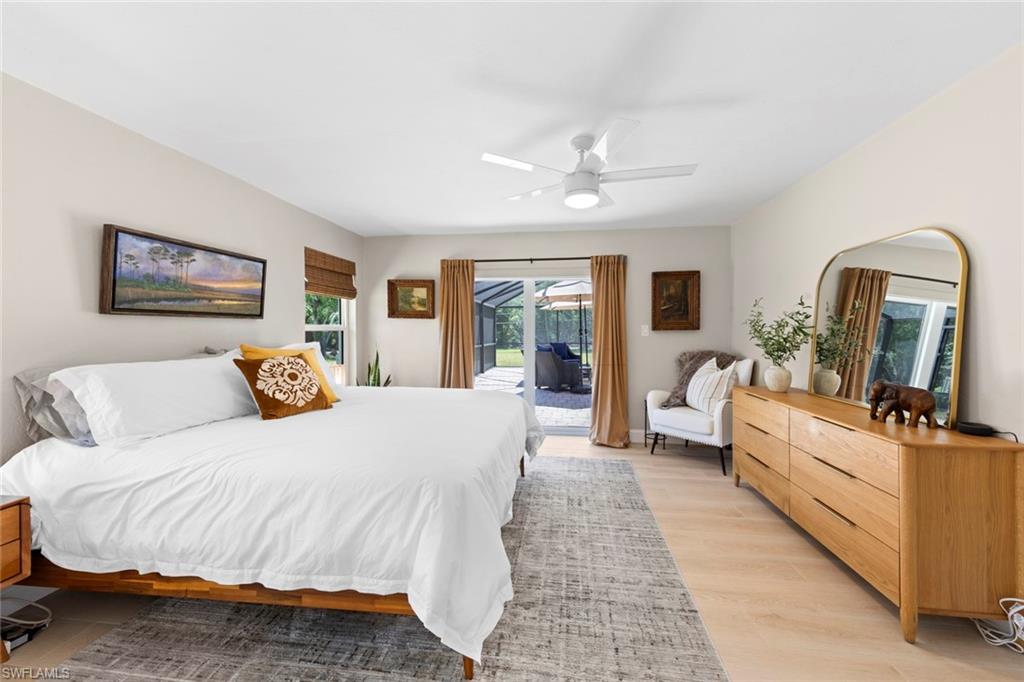 3795 Liberty Square Fort Myers, FL 33908 - Photo 25 of 43 a bedroom with a large bed couch and a window