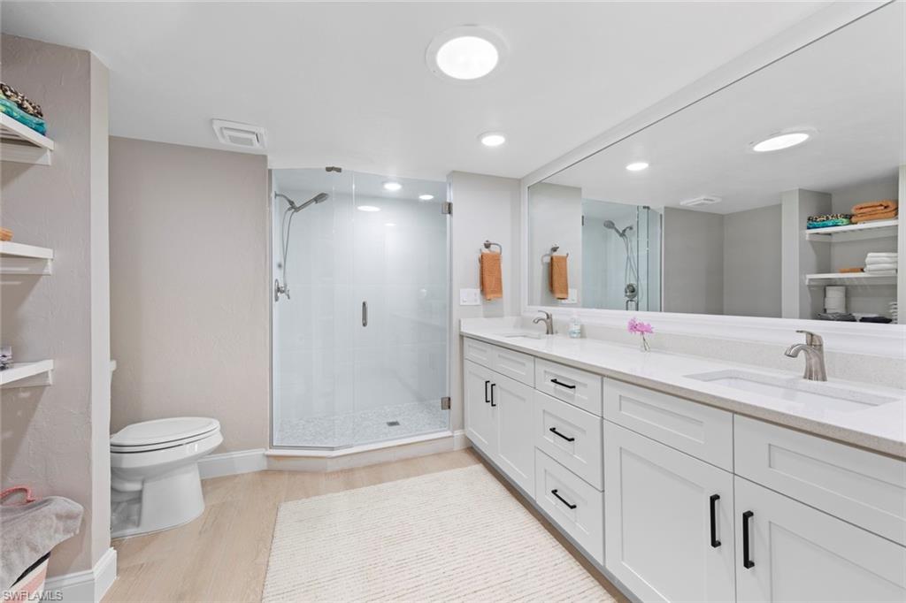 3795 Liberty Square Fort Myers, FL 33908 - Photo 27 of 43 a bathroom with a double vanity sink toilet and shower