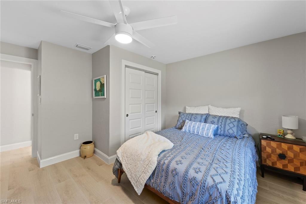 3795 Liberty Square Fort Myers, FL 33908 - Photo 28 of 43 a bedroom with a bed and a window