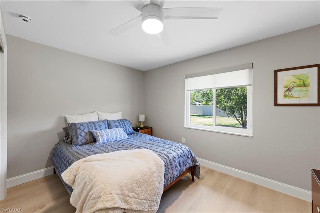 3795 Liberty Square Fort Myers, FL 33908 - Photo 29 of 43 a bedroom with a bed and a window