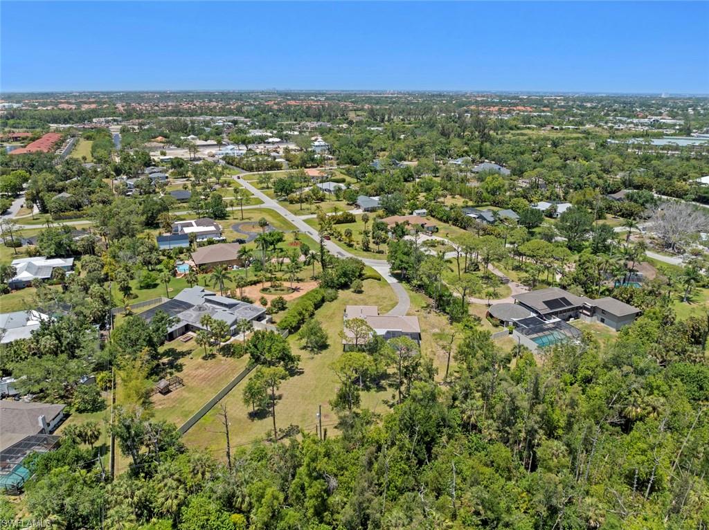 3795 Liberty Square Fort Myers, FL 33908 - Photo 37 of 43 an aerial view of residential houses with outdoor space and trees