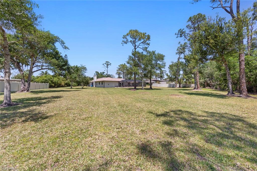 3795 Liberty Square Fort Myers, FL 33908 - Photo 38 of 43 a backyard of a house with lots of green space