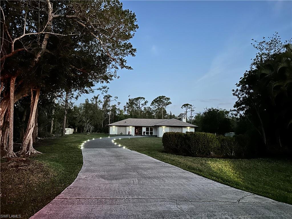 3795 Liberty Square Fort Myers, FL 33908 - Photo 4 of 43 a view of a house with a yard