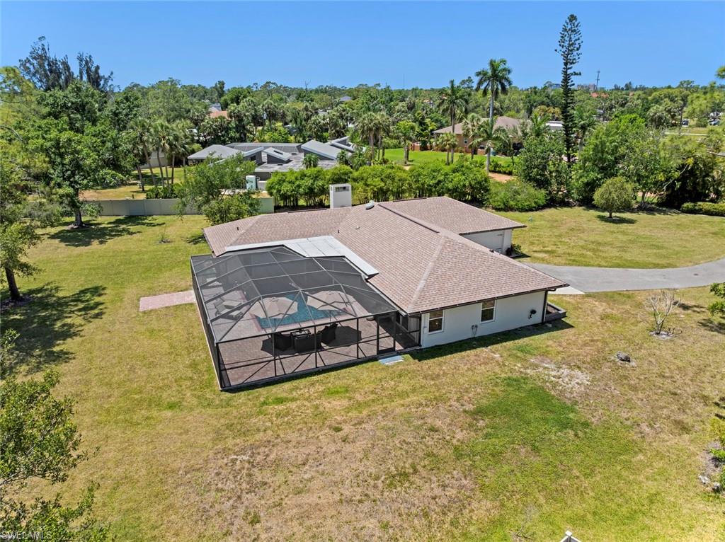 3795 Liberty Square Fort Myers, FL 33908 - Photo 42 of 43 an aerial view of a house with garden space and lake view