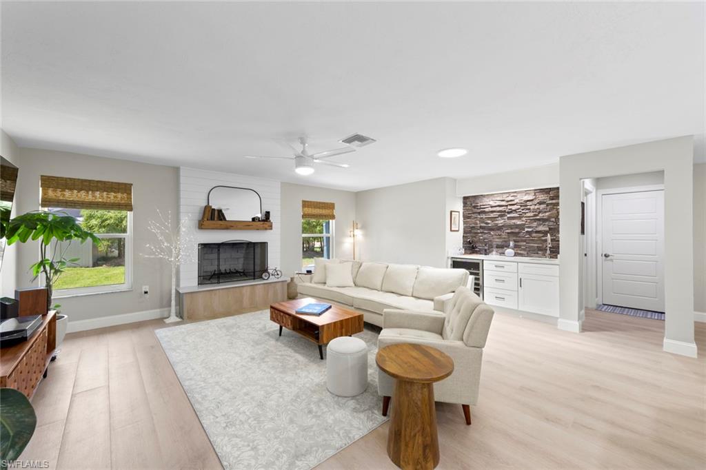 3795 Liberty Square Fort Myers, FL 33908 - Photo 10 of 43 a living room with furniture and a wooden floor