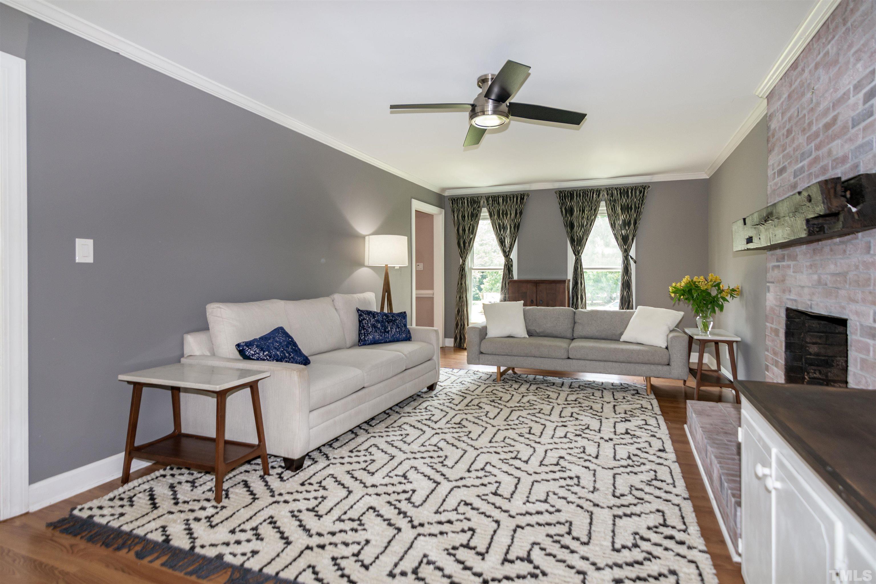 2009 Bason Court Raleigh, NC 27609 - Photo 10 of 40 a living room with furniture and a fireplace