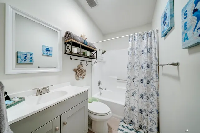 a bathroom with a sink toilet and a shower