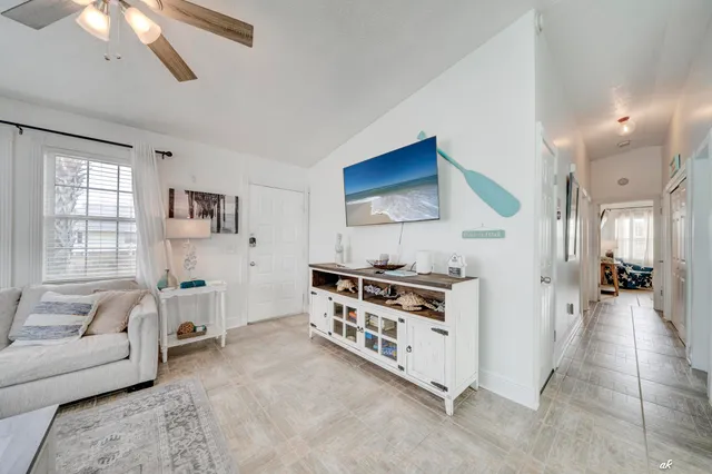 a kitchen with stainless steel appliances a stove a sink and a refrigerator