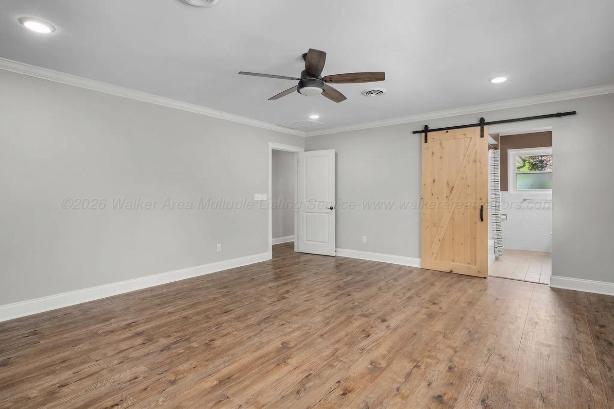 1751 North Walston Bridge Road Jasper, AL 35504 - Photo 29 of 52 Second bedroom with bathroom and exterior access to backyard.