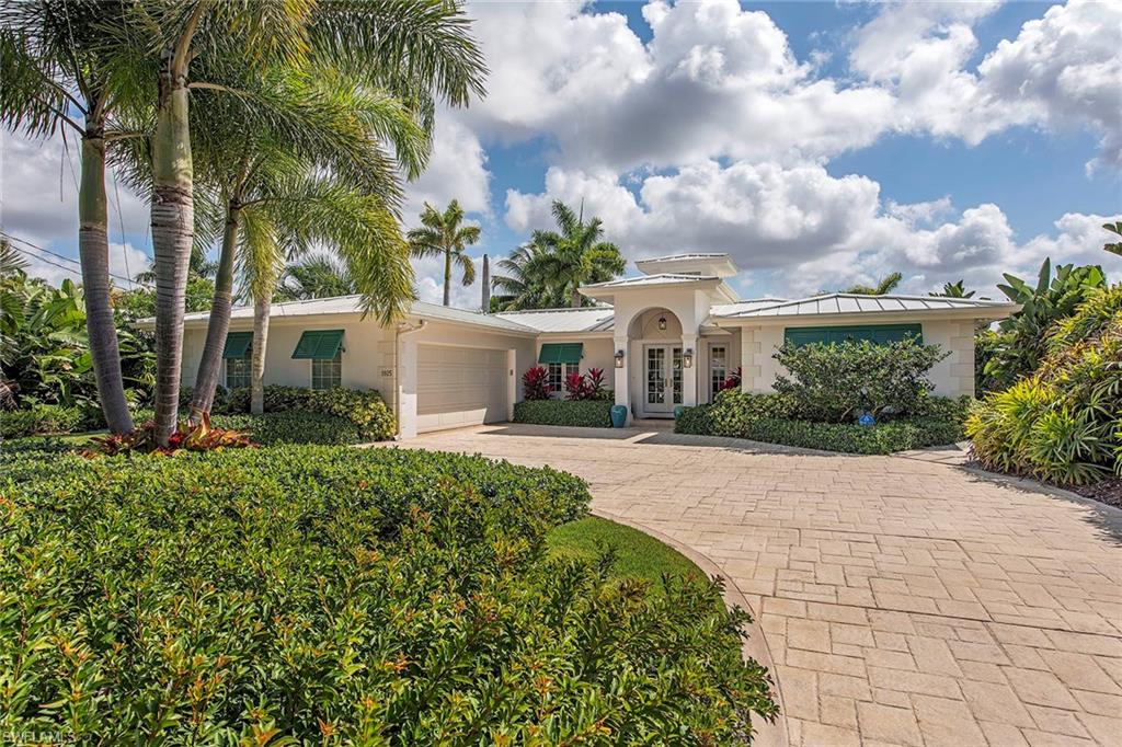 front view of a house with a garden