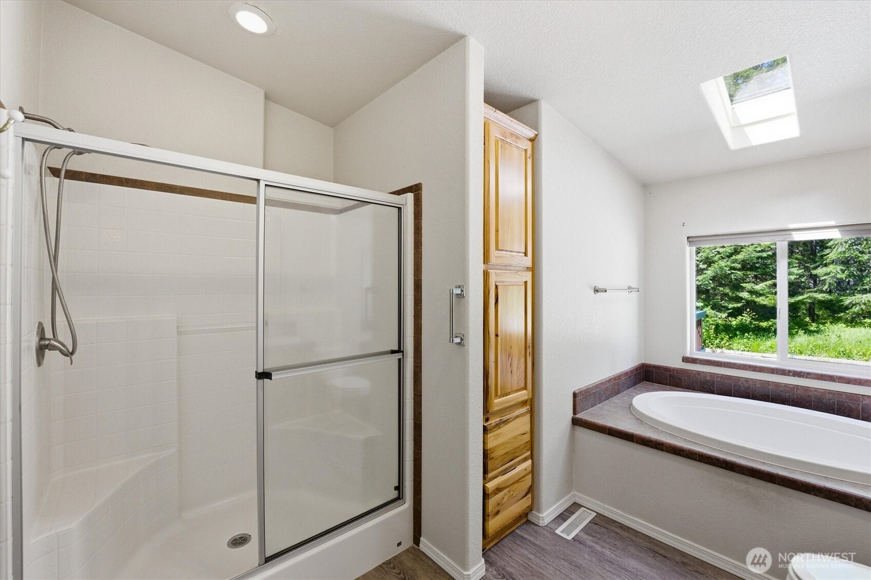 1142 Driskill Road Newport, WA 99156 - Photo 17 of 40 a bathroom with a granite countertop sink a toilet and shower