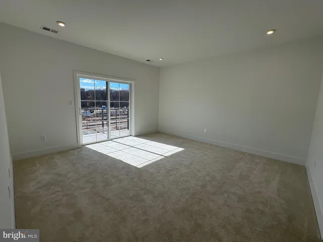 a bathroom with a double vanity sink mirror and shower