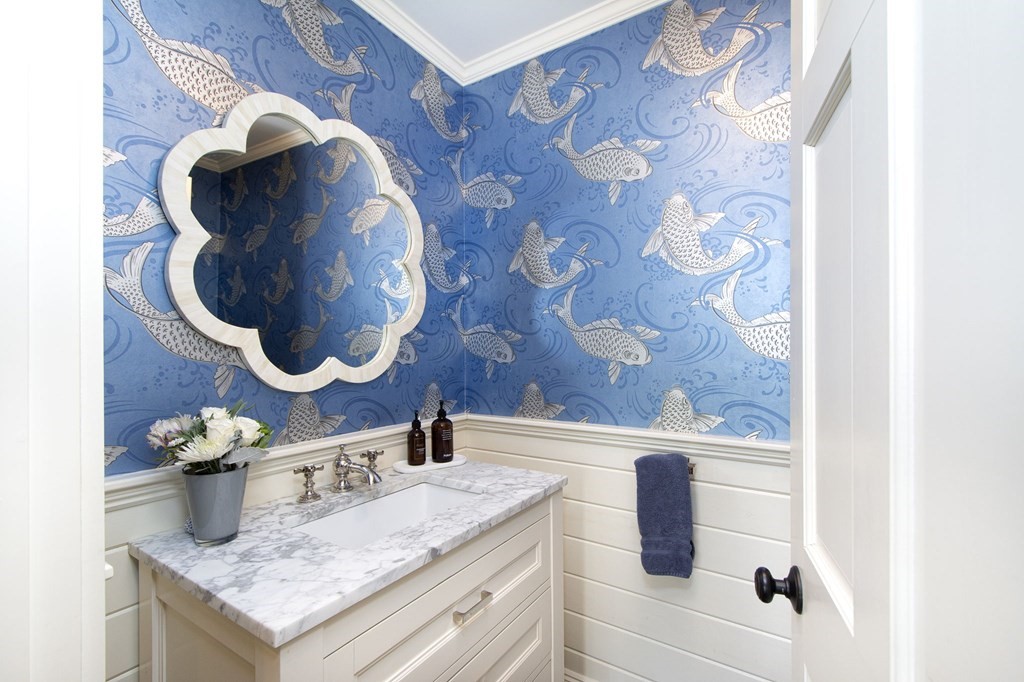 10 River Road Cohasset, MA 02025 - Photo 15 of 42 a bathroom with a granite countertop sink a toilet and mirror