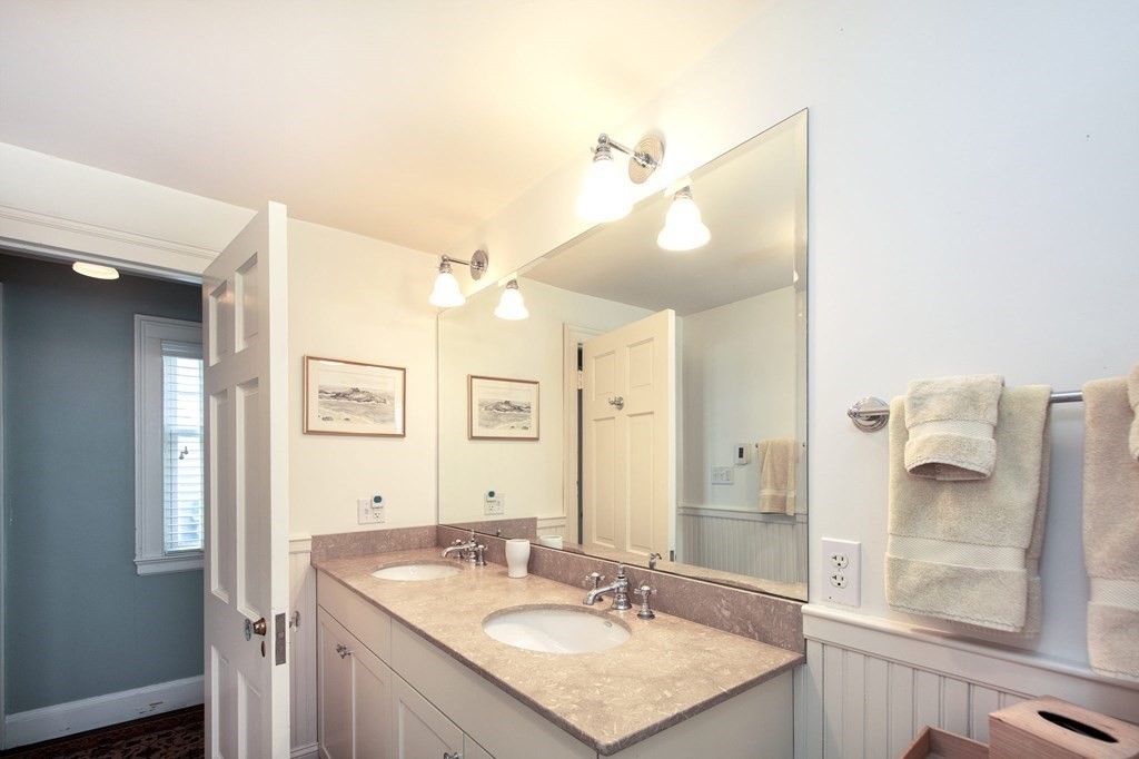 10 River Road Cohasset, MA 02025 - Photo 21 of 42 a bathroom with a granite countertop sink and a mirror
