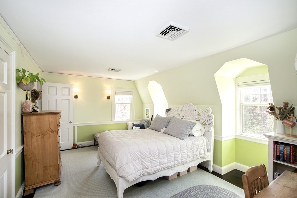 10 River Road Cohasset, MA 02025 - Photo 22 of 42 a bedroom with a bed and a couch