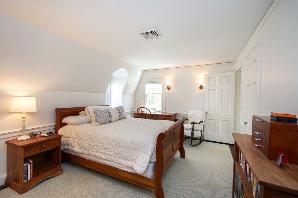10 River Road Cohasset, MA 02025 - Photo 24 of 42 a bedroom with a bed and a desk