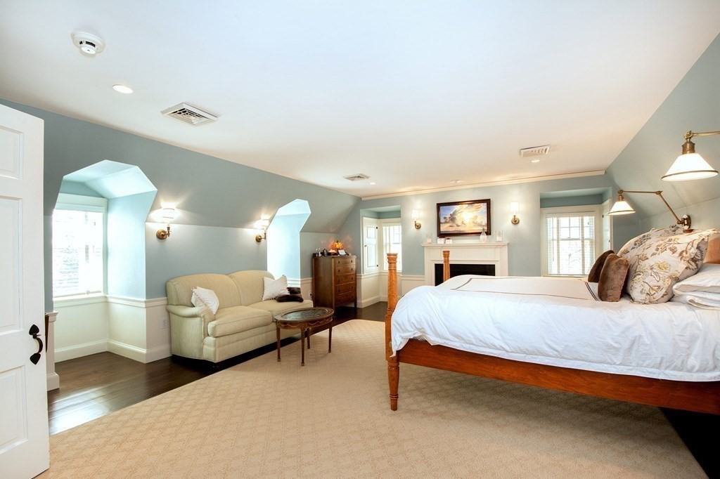 10 River Road Cohasset, MA 02025 - Photo 27 of 42 a bedroom with a bed and a large mirror