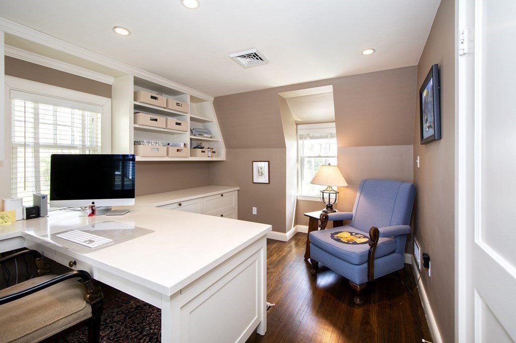 10 River Road Cohasset, MA 02025 - Photo 32 of 42 a view of a workspace with furniture and a flat screen tv