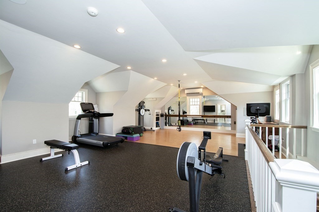 10 River Road Cohasset, MA 02025 - Photo 34 of 42 a room with gym equipment and a flat screen tv