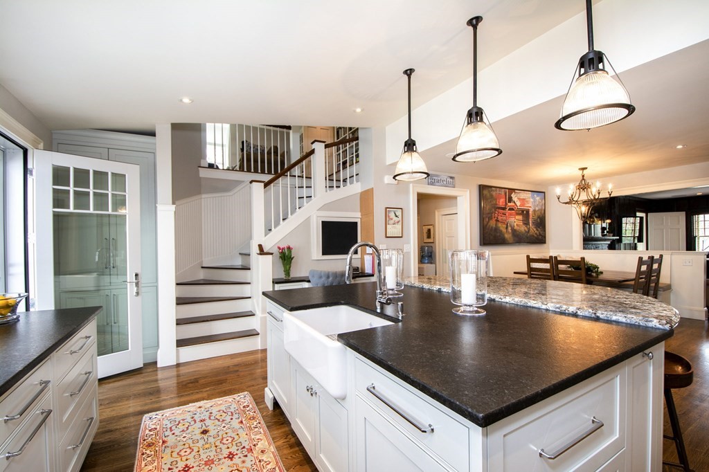10 River Road Cohasset, MA 02025 - Photo 4 of 42 a kitchen with stainless steel appliances granite countertop a sink a counter space and cabinets