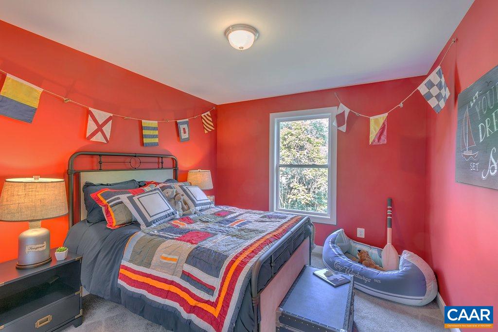 143 Junction Lane Charlottesville, VA 22902 - Photo 15 of 26 a bedroom with a bed and window